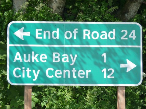 A sign near Juneau's Auke Bay Ferry Terminal points to the end of Glacier Highway. The road would be extended about 50 miles to a new terminal closer to Haines under a state plan that's temporarily on hold. (Ed Schoenfeld/CoastAlaska News)