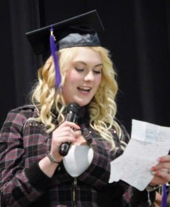 A Revilla High School graduate reads a letter of thanks during the June 1graduation ceremony. (Ed Schoenfeld/CoastAlaska News)