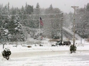 A city snow plow tries to keep up with the heavy snowfall Tuesday morning.