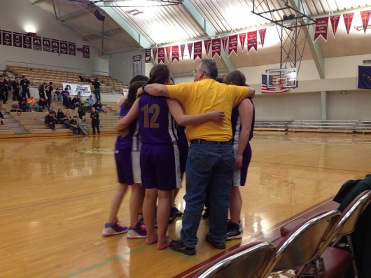 The team huddles during a time-out. The team huddles during a time-out.