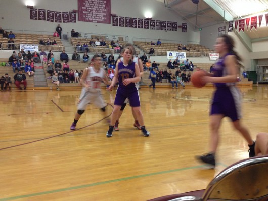 Andrea Cook dribbles past Courtney King in the team's game against Yakutat. Andrea Cook dribbles past Courtney King in the team's game against Yakutat.