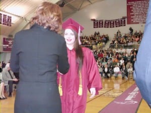 Alexei Weston congratulated by School Board President Michelle O'Brien