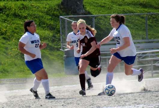 Ketchikan’s Angel Spurgeon tries to keep the ball away from the Sitka Wolves.