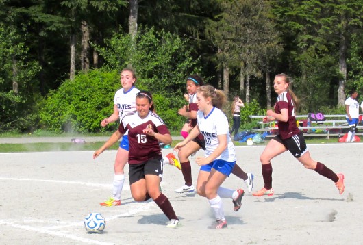 Tia Simpson, Nedalyn Gonzales, and Melody Jacksch of the Ketchikan Lady Kings JV compete against the Sitka Wolves.