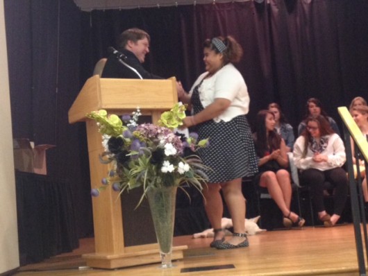Kathryn Carle receives her diploma.