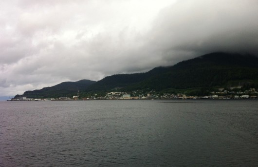 The City of Ketchikan is seen from the water on a cloudy day.