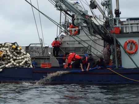 Coast Guard Station Ketchikan boarding team members help the crew of the fishing vessel Vernon dewater their engine room near Ketchikan on Friday. (U.S. Coast Guard photo by Station Ketchikan)