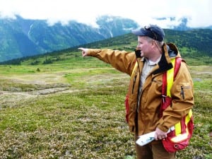 Seabridge Gold's Brent Murphy points to a valley that will be dammed to hold treated mine tailings from the KSM Mine. (Ed Schoenfeld/CoastAlaska News)