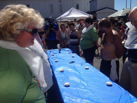 Participants wait for the start of the adult pie eating contest. Eric Reimer won.