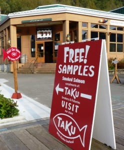 A sign directs visitors to the Taku Fisheries shop on Juneau's waterfront. (Ed Schoenfeld, CoastAlaska News)