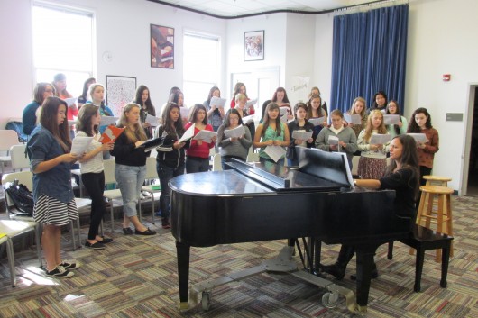 Trina Purcell teaches the newly formed Kayhi women's choir. The choir was split in two because of increased enrollment.