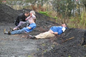 Volunteer victims are treated by emergency responders.