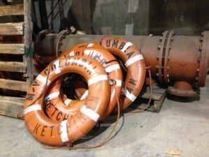 Extra ferry life rings lean against other spare parts at the Ketchikan Marine Engineering Facility at Ward Cove last January. 