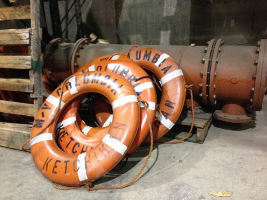 Extra ferry life rings lean against other spare parts at the Ketchikan Marine Engineering Facility at Ward Cove last January.