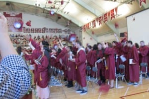 Graduates toss their caps at the end of the ceremony