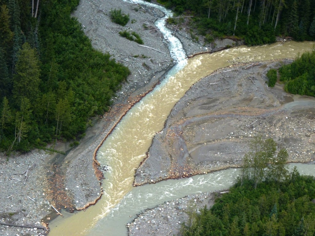 Sulphurets Creek, which drains naturally occurring rusty water from the KSM mine prospect, enters Mitchell Creek upstream from Southeast Alaska. Tribal officials worry mining will send polluted water into British Columbia rivers that flow into Alaska. KSM officials say their pollution-control designs will keep that from happening. (Photo by Ed Schoenfeld/CoastAlaska News)