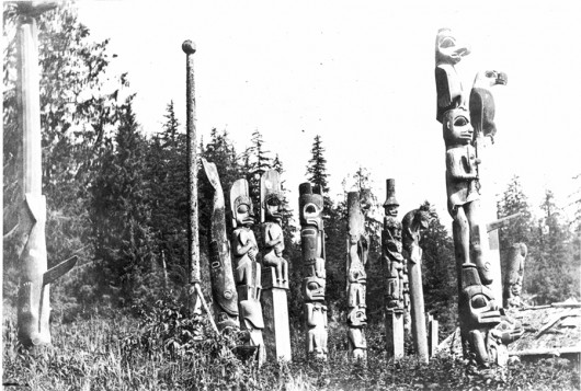 Group of grave totem poles at the south end of Tuxekan village,