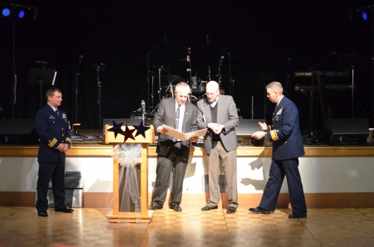 Commander Jack Jackson, Council Member Bob Sivertsen, Mayor Dave Landis and Admiral Daniel Abel officially mark Ketchikan as a Coast Guard City.