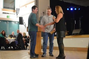 Kenneth Perry and Eric Tyson accept the 2015 business of the year on behalf of Timber and Marine Supply.