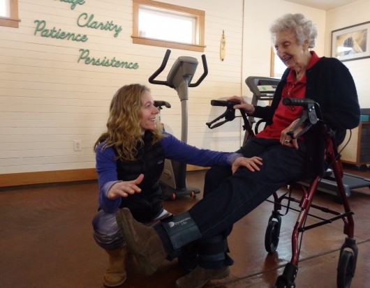 Physical therapist Marnie Hartman works with 92-year-old patient Marge Ward. Hartman says most of her business comes from people 65 and older.   (Photo by Emily Files/KHNS)