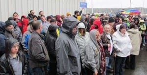 Bernie Sanders supporters caucus in a typical Ketchikan downpour. (Photo by Leila Kheiry)