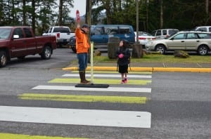 Peter Epler helps a Houghtling student cross safely Monday morning. 