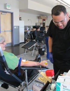 William Amituanai checks to see how donor Jane Bolima is doing.