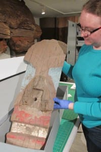 Chambers displays a fragment from the Coast Guard pole.