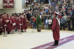 Sylvan Blankenship leads the graduates in the tassel turn.