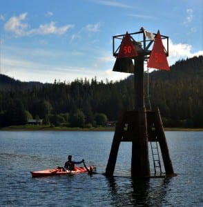 Britta Adams and Mike Schuler celebrate reaching their goal of Marker 50 in the Wrangell Narrows. (Photo by Mark Adams)