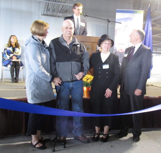 From left, Marna Cessnun, Mike Cessnun, Jennifer Johnson and David Johnson prepare to cut the ribbon during the dedication of PeaceHealth Ketchikan Medical Center's addition. (Photo by Leila Kheiry)