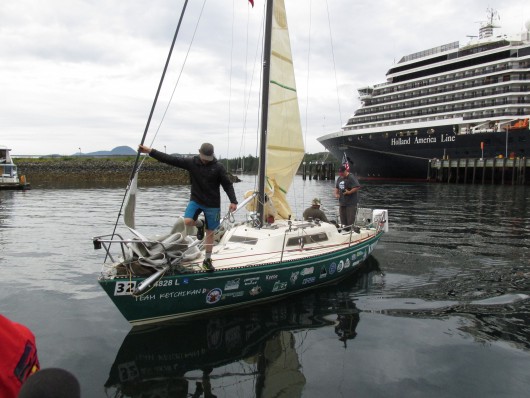 Team Ketchikan sails and rows the Kermit across the Race to Alaska finish line. (Photo by Leila Kheiry)