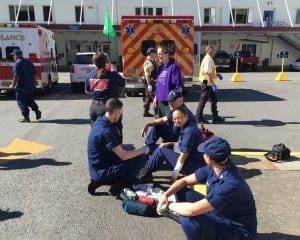 Emergency Medical Technicians practice treating minor wounds during an active shooter drill at the Ketchikan Coast Guard base. (Photo by Leila Kheiry)