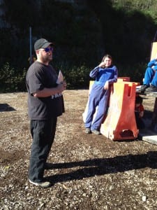 Frank Wyne discusses strategy with players.