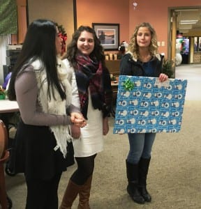 Kayhi Rotary Interact members Angie Gomez, Alison Blair and McKenzie Harrison are ready to present a big check to the Ketchikan Pioneers Home. (Photo by Leila Kheiry)