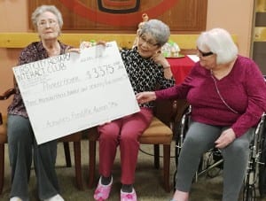 Pioneers Home residents with the big check, representing the proceeds of this year's Rotary Interact pie sale. (Photo by Leila Kheiry)