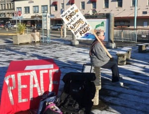 Harriet Edwards takes a break during Saturday's Women's March in Ketchikan. (Photo by Leila Kheiry)