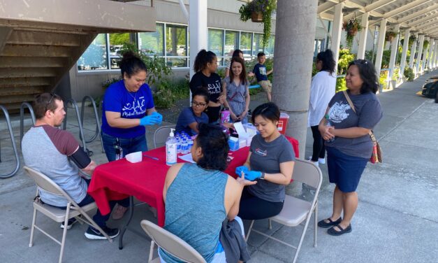 Volunteers discuss Ketchikan Wellness Coalition’s weekend blood pressure screening