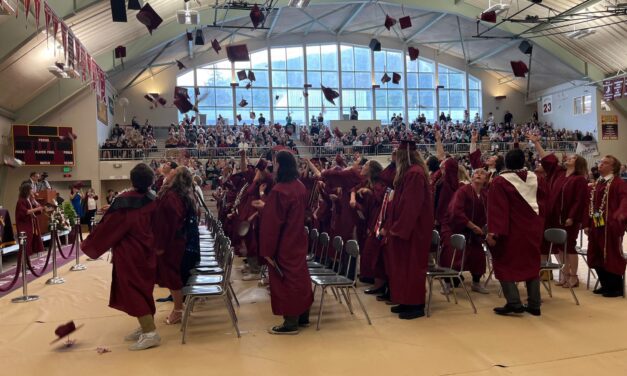 Ketchikan High School’s class of 2023 toss their caps